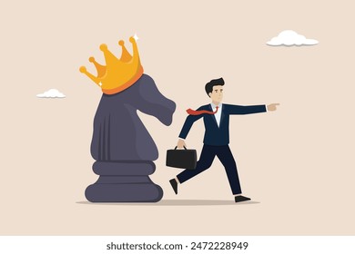 Strategy to win business competition, business tactic to overcome obstacle concept, smart businessman pointing finger to direct chess knight with king crown.