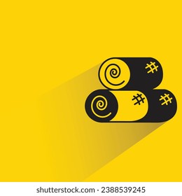 straw bale with shadow on yellow background