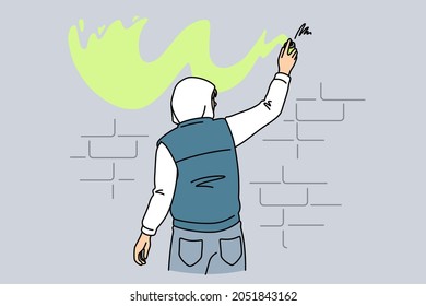 Street art and graffiti concept. Young man standing backwards making graffiti with yellow color on wall outdoors vector illustration 