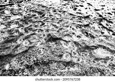 Street covered pebbles on sea coast.Rough uneven little bit fraction grunge marble terrace pathway.Damaged breaking old rustic stone. Scratched shabby grungy granite lava for 3d seaside vintage design