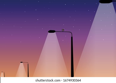 Street Lanterns On The Background Of The Starry Evening Sky. An Owl Sitting On One Of The Lanterns.