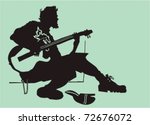 The street musician - a black silhouette