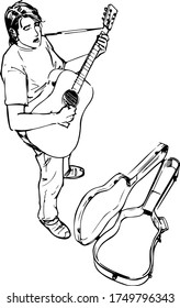 street musician plays his guitar