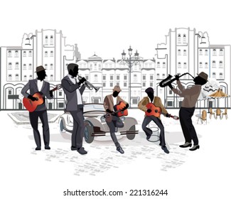 Street musicians with a saxophone, guitars, a trumpet on the background of a street cafe 