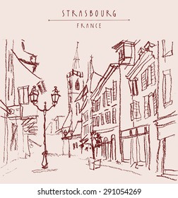 Street in old town center of Strasbourg, Bas Rhin, France. Historical buildings, church, shops and lights. Bold freehand drawing with black charcoal on paper. Travel sketch postcard design template
