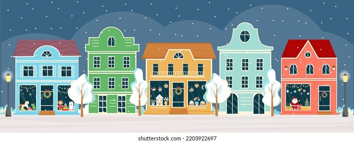 Street with shops and houses at winter night on Christmas eve. Sweet shop, candy store, confectionery, bakery with Christmas decoration. Winter town, city panorama. Christmas shop, street.