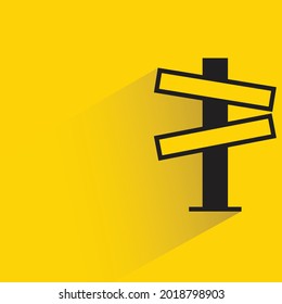 street signpost and signage with shadow on yellow background