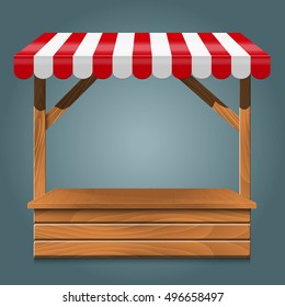 Street stall with red awning and wooden rack.