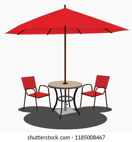 Street table with chairs under a red umbrella
