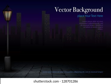 Streetlight at Night and City in Background