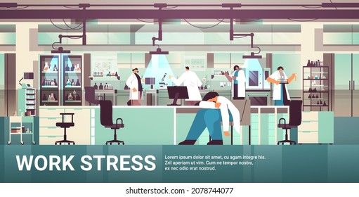 stressed overworked researcher sleeping at workplace tired upset scientist having work stress hospital lab interior