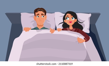 

Stressed Young Couple Sitting in Bed Vector Cartoon Illustration. Unhappy husband and wife going to bed angry at each other 
