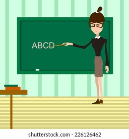 Strict teacher in the classroom shows letters on the blackboard.by the pointer. 