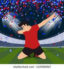 striker soccer football player in red team concept celebrating goal in the stadium during match