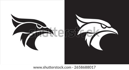 A striking black eagle hawk head on white, mirrored by a white head on black, symbolizing power and vigilance.