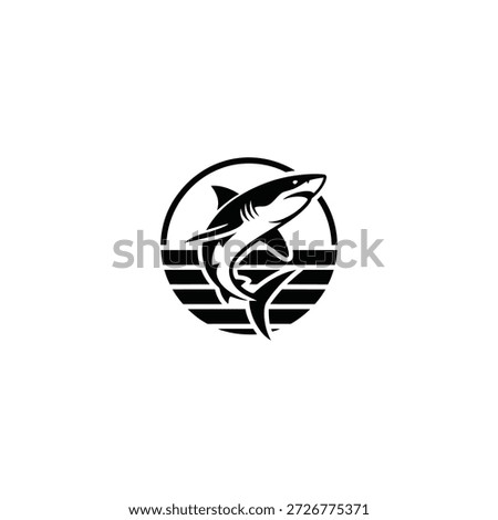A striking black and white logo featuring a shark and ocean waves