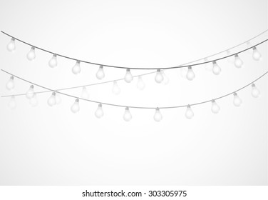 String Of Lights. Hanging Light Bulbs Isolated Over White