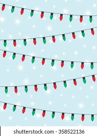 Strings of red and green christmas lights over blue background