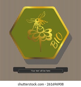 Striped gray background green hexagon with gold frame within which depicted sitting on a flower bee with the word bio, a hexagon-text banner