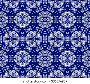 Striped hand painted vector seamless pattern with ethnic and tribal motifs, zigzag lines, brushstrokes and splatters of paint in multiple bright colors. Vector illustration