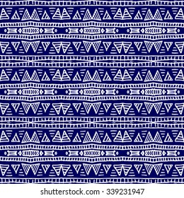 Striped hand painted vector seamless pattern with ethnic and tribal motifs, zigzag lines, brushstrokes and splatters of paint in multiple bright colors. Porcelain tile. Vector illustration.