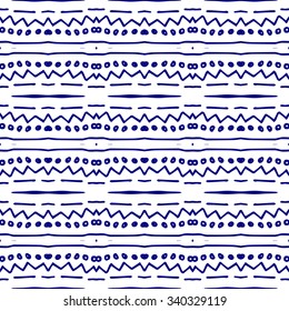 Striped hand painted vector seamless pattern with ethnic and tribal motifs, zigzag lines, brushstrokes and splatters of paint in multiple bright colors. Porcelain tile. Vector illustration.