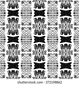 Striped hand painted vector seamless pattern with ethnic and tribal motifs, zigzag lines, brushstrokes paint in monochrome colors. Vector seamless pattern hand drawn. Repeating geometric mesh tiles