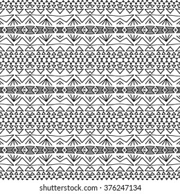 Striped hand painted vector seamless pattern with ethnic and tribal motifs, zigzag lines, brushstrokes paint in monochrome colors. Vector seamless pattern hand drawn. Repeating geometric mesh tiles