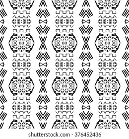 Striped hand painted vector seamless pattern with ethnic and tribal motifs, zigzag lines, brushstrokes paint in monochrome colors. Vector seamless pattern hand drawn. Repeating geometric mesh tiles