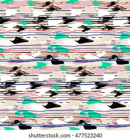 Striped hand painted vector seamless pattern with ethnic and tribal motifs, thin lines, brushstrokes and splatters of paint in multiple bright colors for summer fall fashion