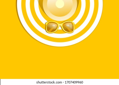 striped hat and sunglasses on a yellow background