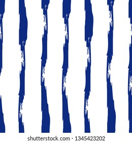 Striped seamless pattern. Abstract stripes. Hand drawing, brushes, blots. Modern textures. Original background. Vertical stripes. Blue