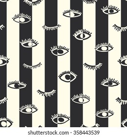 Striped seamless pattern in the bohemian style. Repeating hand drawn tribal print of open and close eyes. Ethnic background for web page, fabric design, scrapbook, banner, wrapping paper, cards, cover