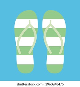 Stripped green and white flip flops on the beach. Pair of sandals in colorful summer pool or sea beach. 