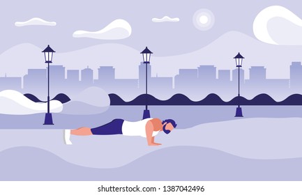 strong athletic man doing push-ups in the park