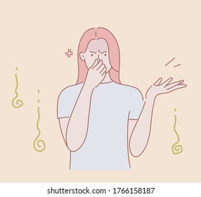 Strong stink. A young girl pinches her nose and waves her hand, it stinks strongly around.Toxic. Hand drawn style vector design illustrations.