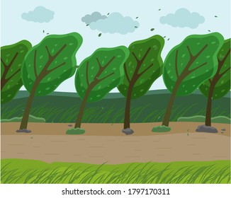 Strong wind and heavy fall of the leaves in the forest. Autumn wind blowing in the park. Green trees bend to the ground from strong winds, the sky is filled with clouds, Empty park in bad weather