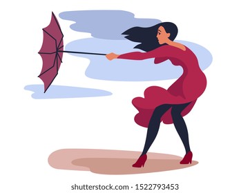 strong wind pulls an umbrella out of the hands of a girl