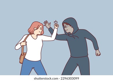 Strong woman fights back against thief by showing self-defense techniques to man who tried to steal purse and commit crime. Self-defense and martial art concept of krav maga against street thug