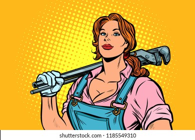 A strong woman mechanic plumber worker with adjustable wrench. Pop art retro vector illustration vintage kitsch