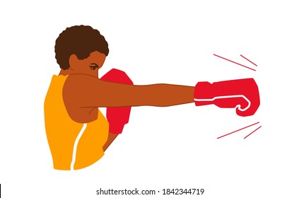 A strong young adult African American woman boxer throws a jab punch. A pretty box fighter girl boxing. A boxer attack side view.