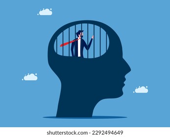 Stuck in conventional thinking. Businessman in a human head prison