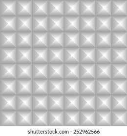 Studded background. Pointed, pyramidal shapes pattern. Seamlessly repeatable. Grayscale, monochrome version.
