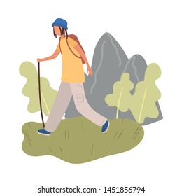 Student boy with blue hat and backpack walking with wood stick