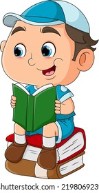 The student boy is sitting on the book and reading a book of illustration