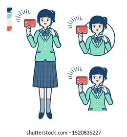 A student girl in a green blazer with pointing at credit card images.
It's vector art so it's easy to edit.

