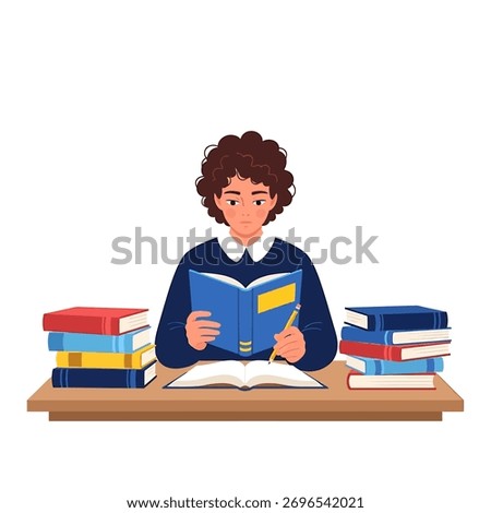 A student is reading a book and taking notes at a desk with stacks of books on either side.