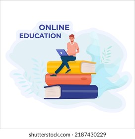 Student studying online. Online education concept. Online lesson. Pile of books. Man with a laptop.