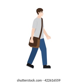 A student walking, with a sling bag.
