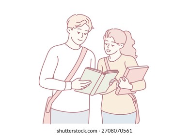 Los estudiantes discuten activamente y hacen referencia a los recursos de aprendizaje juntos, los estudiantes colaboran estrechamente utilizando tabletas digitales y libros de texto impresos para una comprensión integral